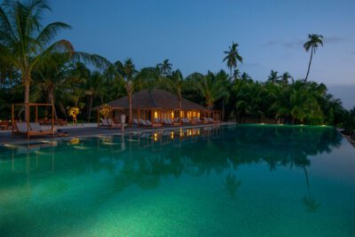 The Residence Maldives Dhigurah Review - Infinity Pool Beach Club at Night